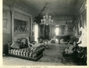 Titre original&nbsp;:  Image from Hamilton Public Library, Local History and Archives.
Wesanford, drawing room, after 1917. On the left of the hall is the drawing room, a vision of ivory and gold in Louis XIV style. It is a large room, about 40x25 feet, with a high ceiling that sets off the pretty scheme of decoration to advantage. The walls are of ivory enamel picked out with gold leaf with delicate rose pink satin panels woven in delicately intricate designs. Along the upper edge are jolly little Cupids engaged in the pretty vagaries that seem to constitute their mission in life. The mantel is composed of large slabs of Mexican onyx... The woodwork of the furniture is white and gold, upholstered in brown and gold. One of the largest make of Steinway pianos stands on one side.  Hamilton Spectator, June 8, 1892.