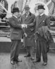 Titre original&nbsp;:  Rt. Hon. W.L. Mackenzie King and Sir George MacLaren Brown being greeted by Hon. Peter Larkin aboard S.S. MONTCALM en route to the Imperial Conference at London. 