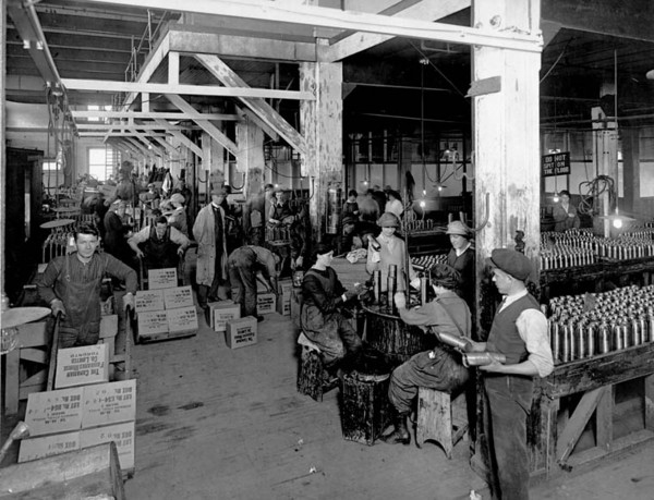 Original title:  "Packing and Lacquer Room" in 75 mm shell shop. 75mm American High Explosive shells. The Canadian Fairbanks-Morse Co. Ltd., Mfg. Dept. 1379 Bloor St. W. Toronto, Ont. 